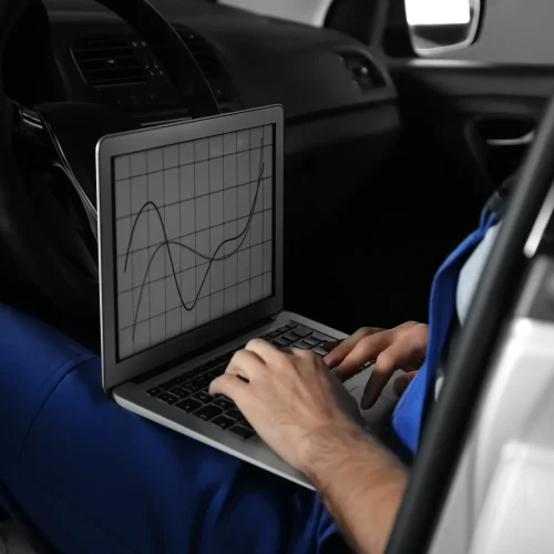 mechanic-with-laptop-doing-car-diagnostic-at-autom-2026-01-22-19-18-37-utc copy